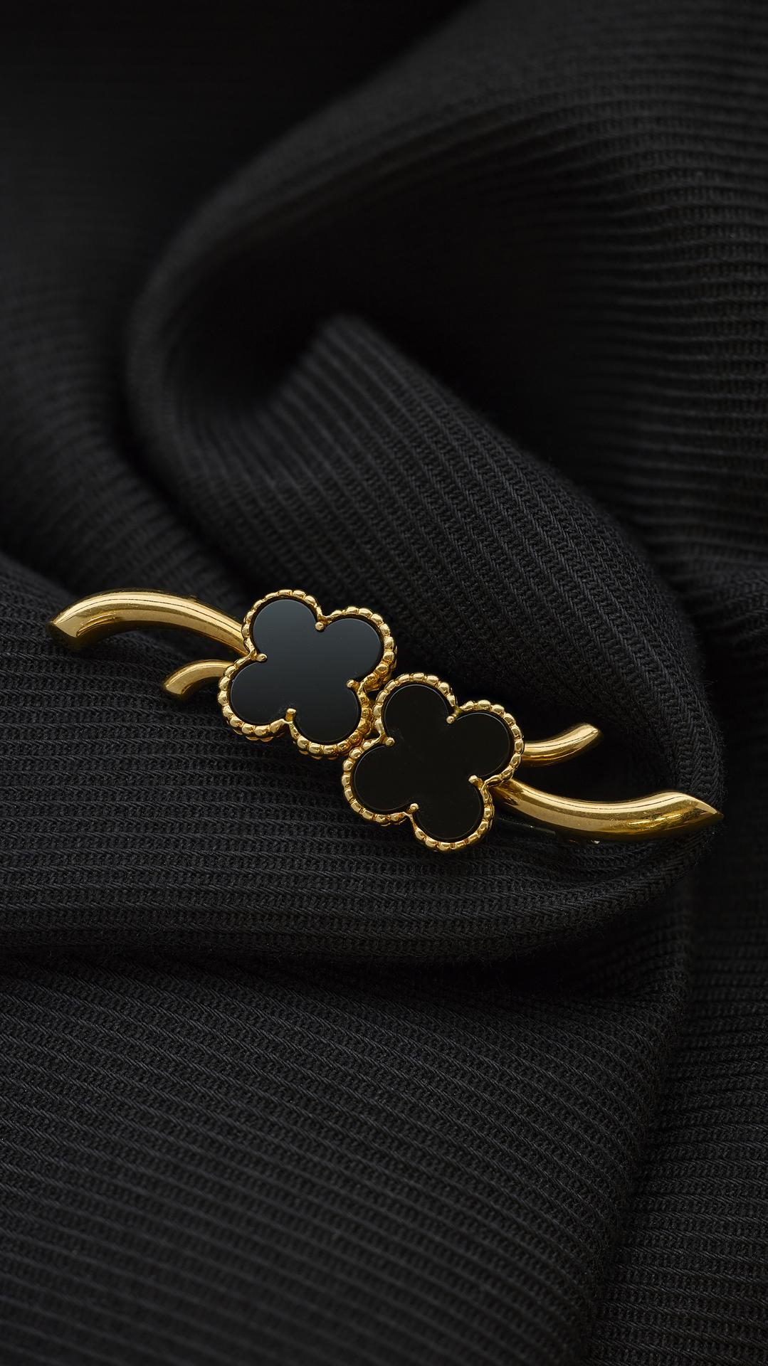 Van Cleef & Arpels Onyx Alhambra Brooch