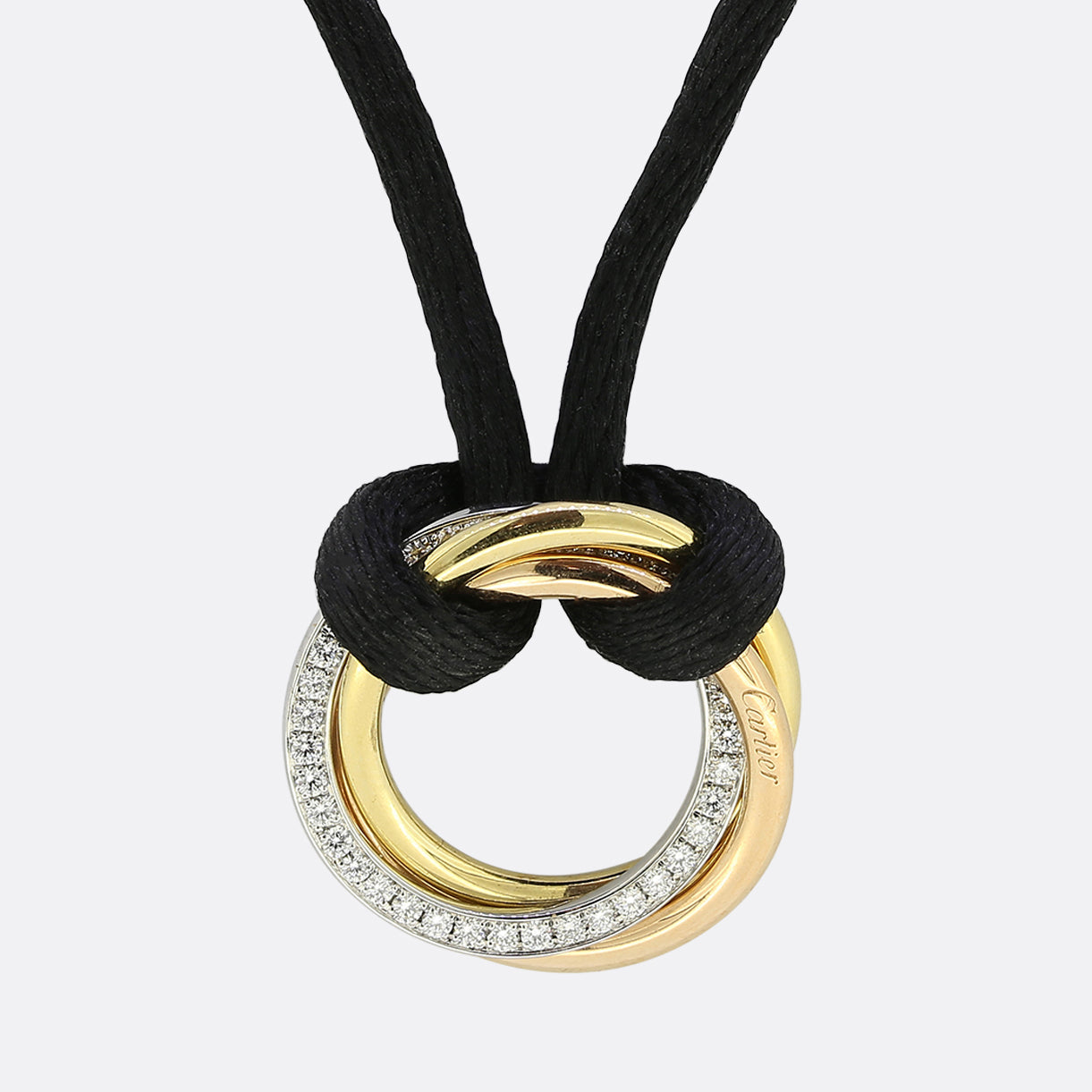 Cartier - CARTIER 18K TRI COLOR TRINITY WITH DIAMONDS PENDANT ON A BLACK  CORD NECKLACE