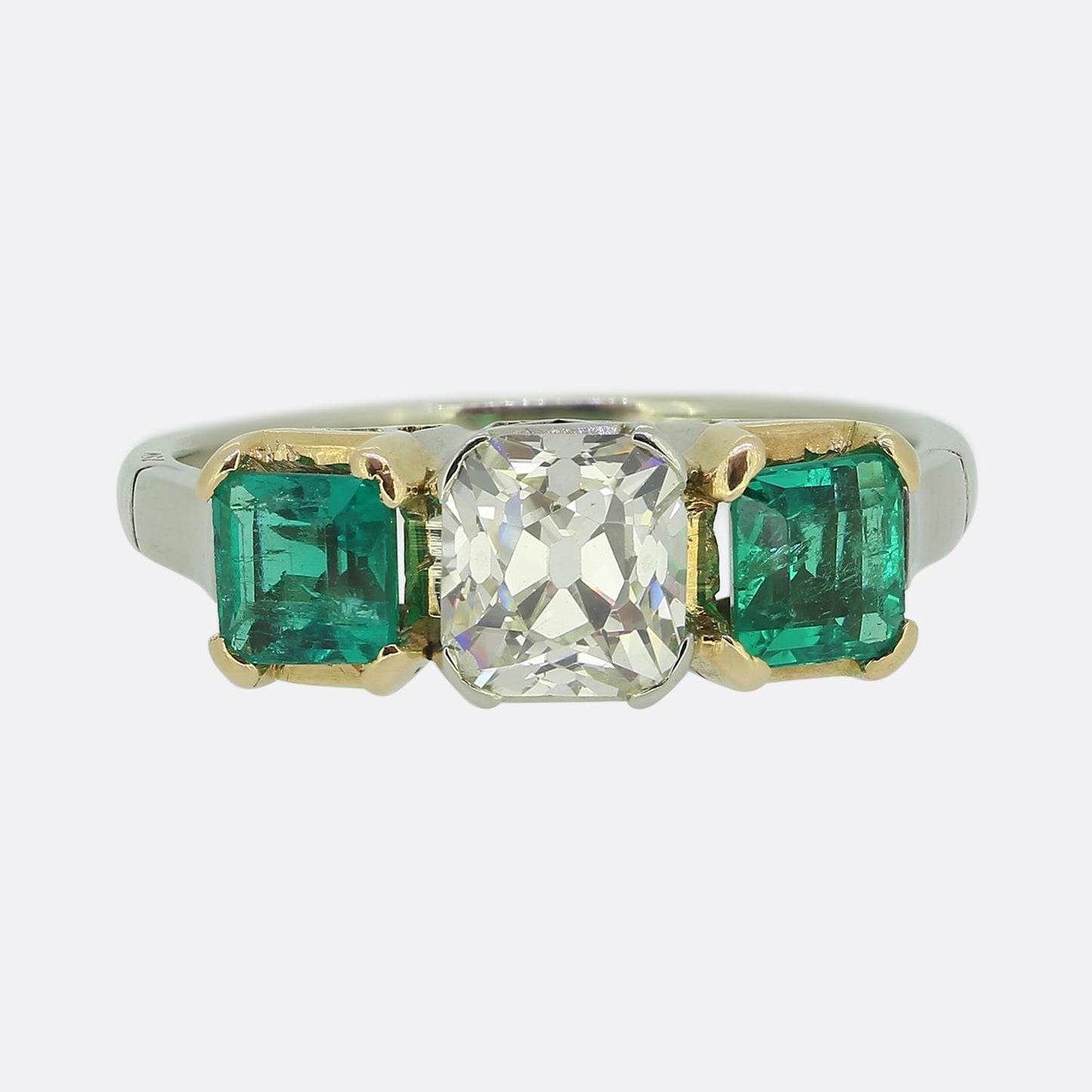 Early 20th Century 1.30 Carat Diamond and Emerald Three-Stone Ring