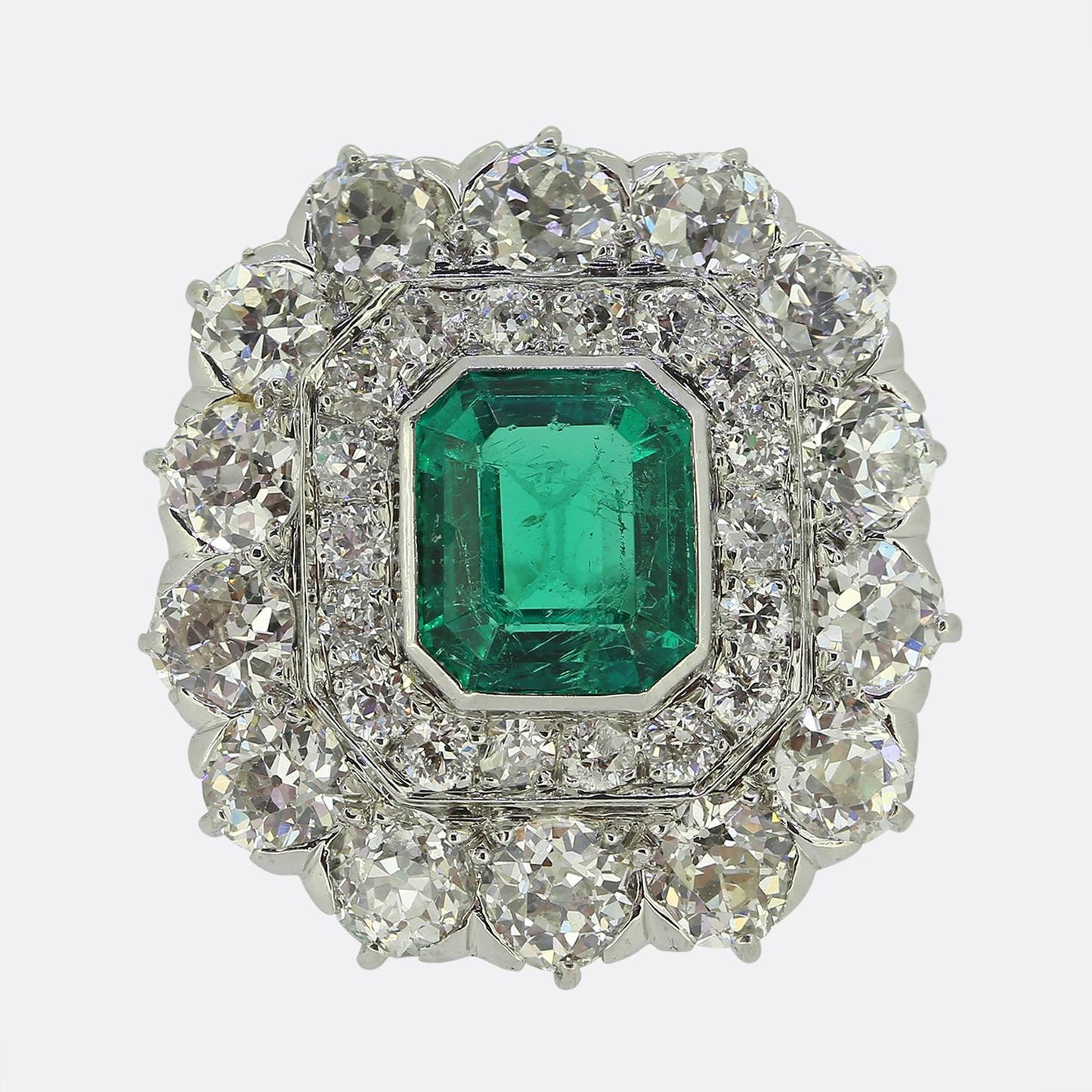 Antique 1.20 Carat Emerald and Diamond Cluster Ring