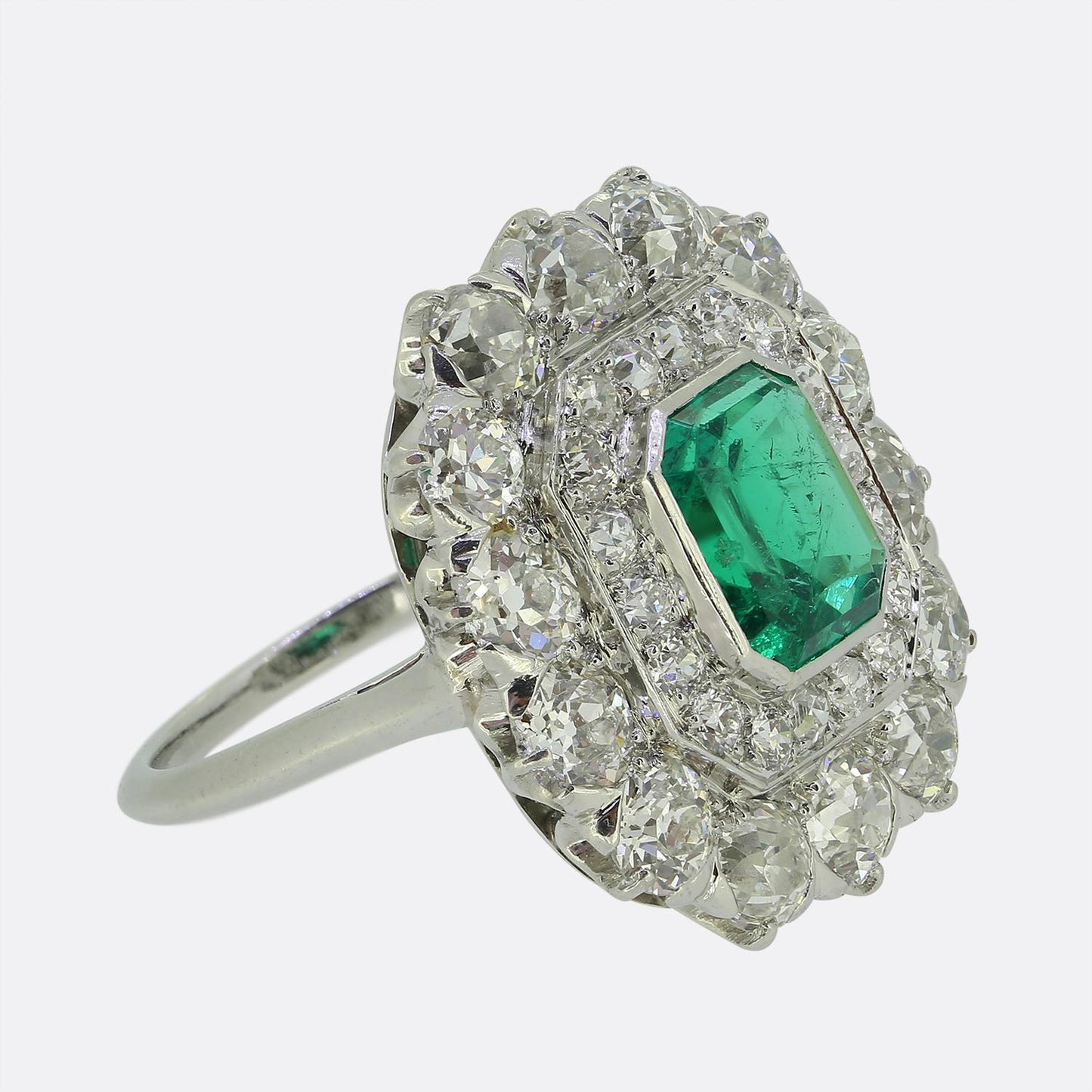 Antique 1.20 Carat Emerald and Diamond Cluster Ring