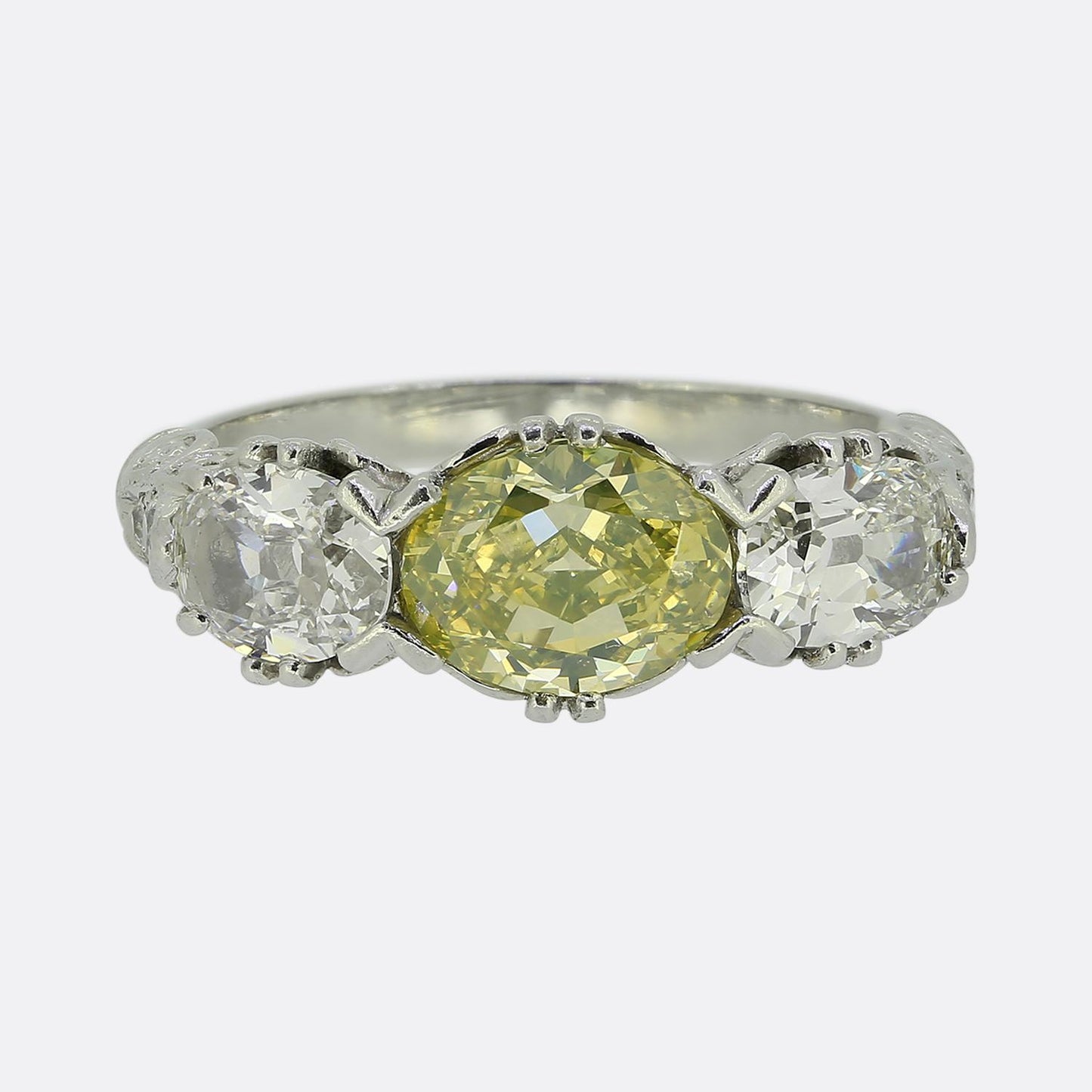 Early 20th Century Vivid Yellow Green Diamond Three-Stone Ring