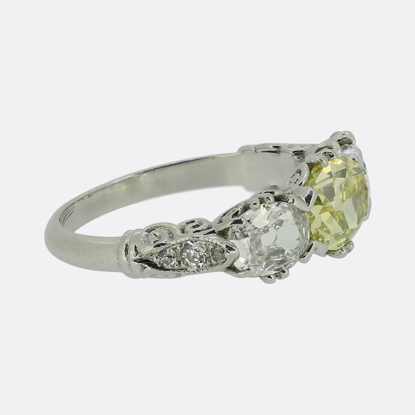 Early 20th Century Vivid Yellow Green Diamond Three-Stone Ring